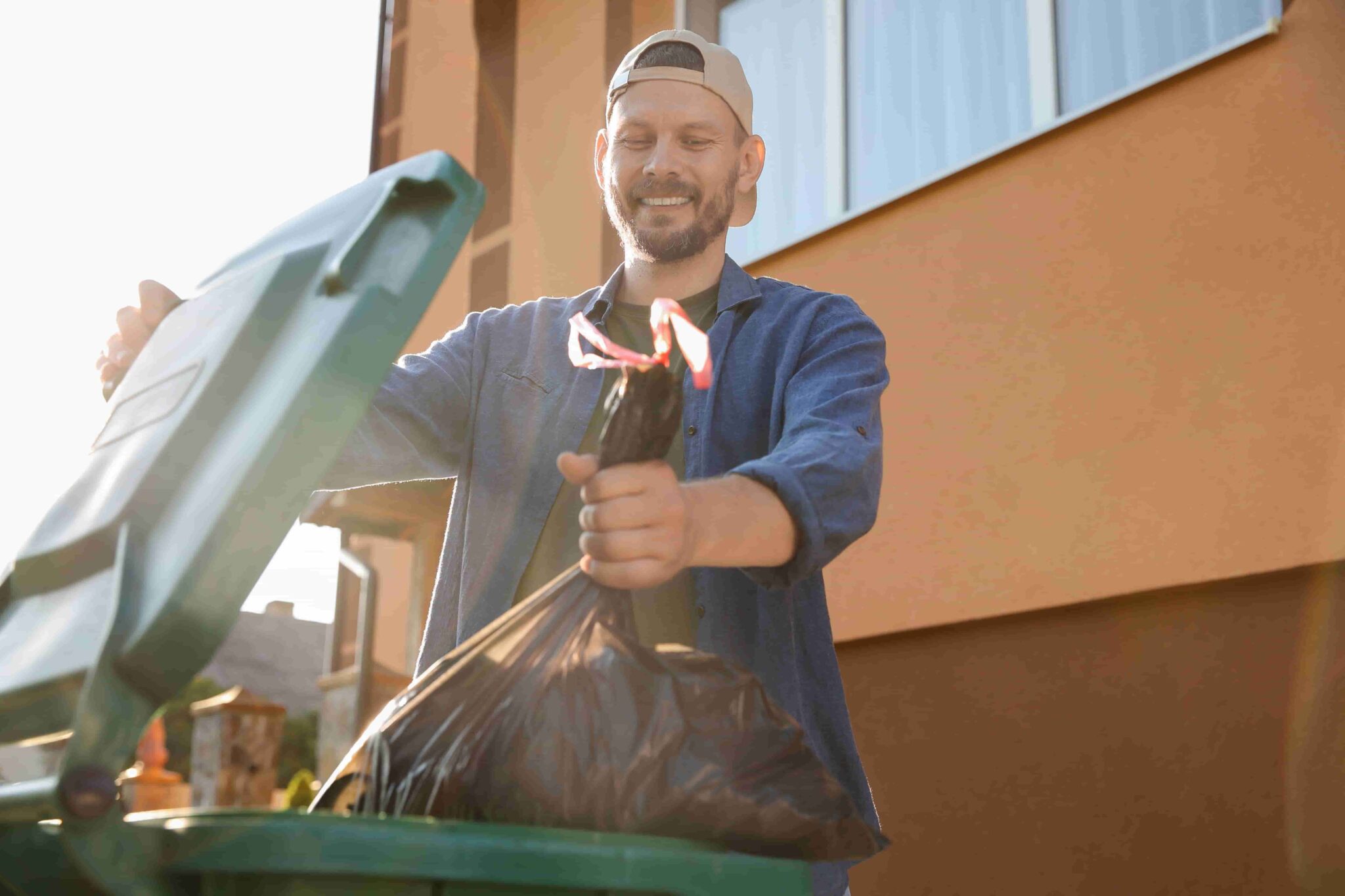 worker emptying the bin